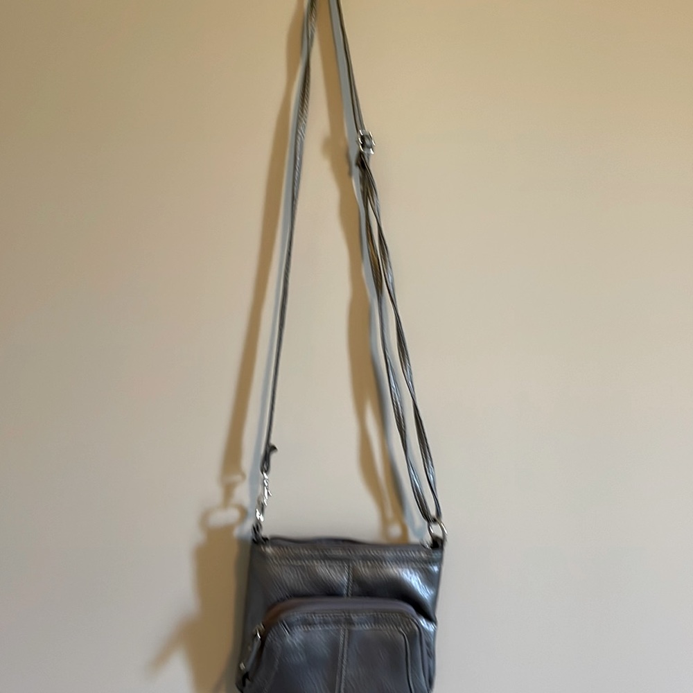 Crossbody with adjustable strap.